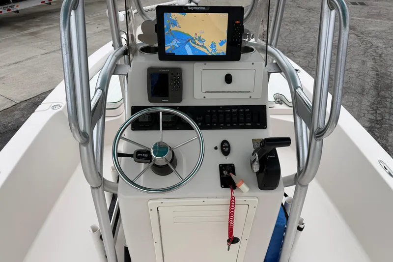 Slide: The Image of Center console of a 2006 Pathfinder 2200 Tournament Edition boat with navigation equipment. - 11