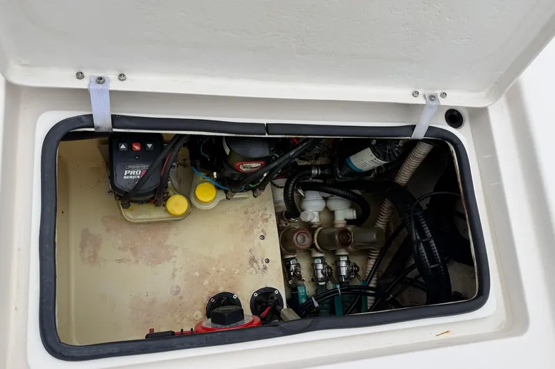 Slide: The Image of Open hatch of 2006 Pathfinder 2200 Tournament Edition showing internal components and wiring. - 12