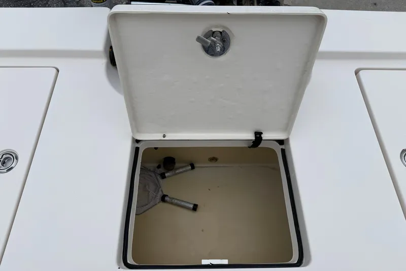 Slide: The Image of Open storage compartment on a 2006 Pathfinder 2200 Tournament Edition boat. - 13