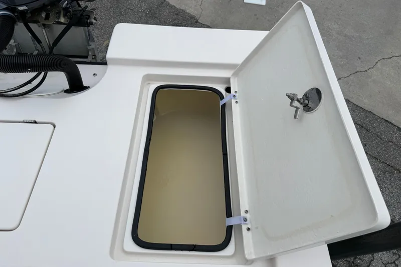 Slide: The Image of Open storage compartment on 2006 Pathfinder 2200 Tournament Edition boat. - 14