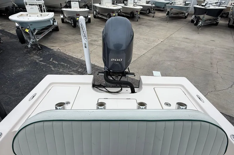 Slide: The Image of 2006 Pathfinder 2200 Tournament Edition boat with 200 HP engine, docked among other boats. - 15