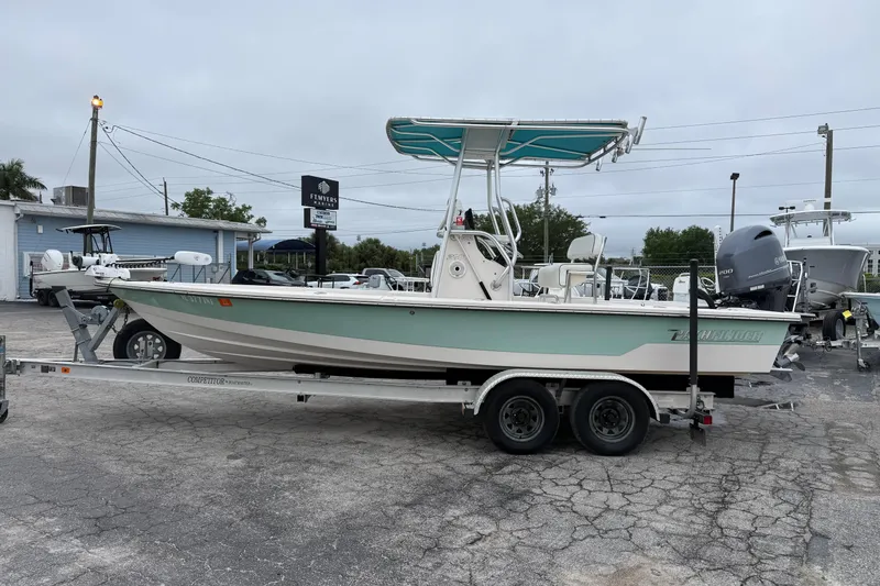 Slide: The Image of 2006 Pathfinder 2200 Tournament Edition boat on trailer at dealership. - 16