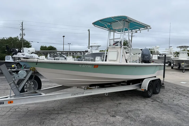 Slide: The Image of 2006 Pathfinder 2200 Tournament Edition boat on trailer in parking lot. - 17