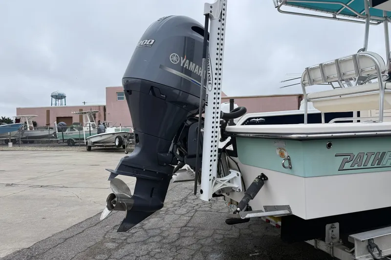 Slide: The Image of 2006 Pathfinder 2200 Tournament Edition boat with Yamaha outboard motor in a marina setting. - 3
