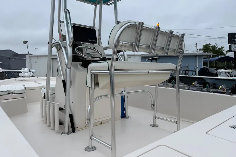 Slide: The Image of 2006 Pathfinder 2200 Tournament Edition boat interior with steering console and seating. - 7