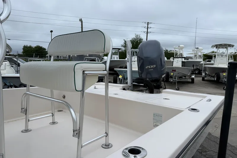 Slide: The Image of 2006 Pathfinder 2200 Tournament Edition boat with Yamaha 200 engine, docked outdoors. - 8