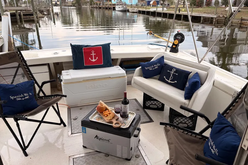 Slide: The Image of Cozy seating area on a 2000 Provincial 42 Pleasure Boat with nautical-themed decor. - 11