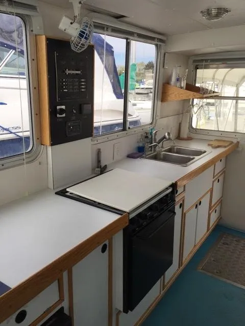 Slide: The Image of Kitchen area on a 2000 Provincial 42 Pleasure Boat. - 18