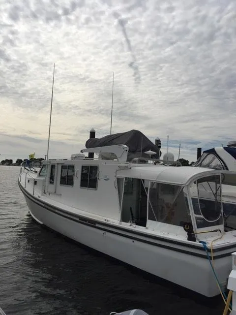 Slide: The Image of Provincial 42 Pleasure Boat from 2000 on calm water. - 2