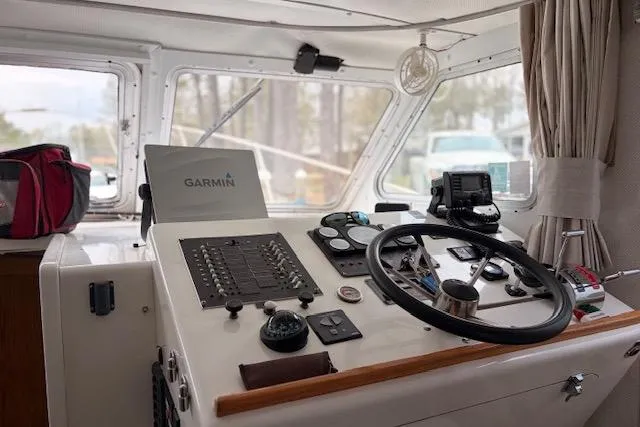 Slide: The Image of Cockpit of 2000 Provincial 42 Pleasure Boat with Garmin navigation system. - 23