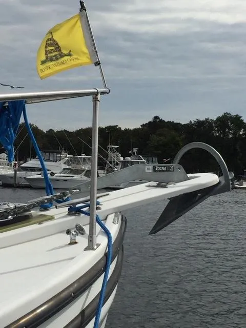 Slide: The Image of Provincial 42 Pleasure Boat from 2000 docked with yellow flag. - 3