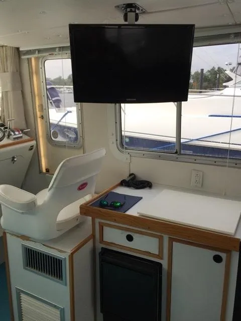 Slide: The Image of Interior of 2000 Provincial 42 Pleasure Boat with TV and seating. - 33