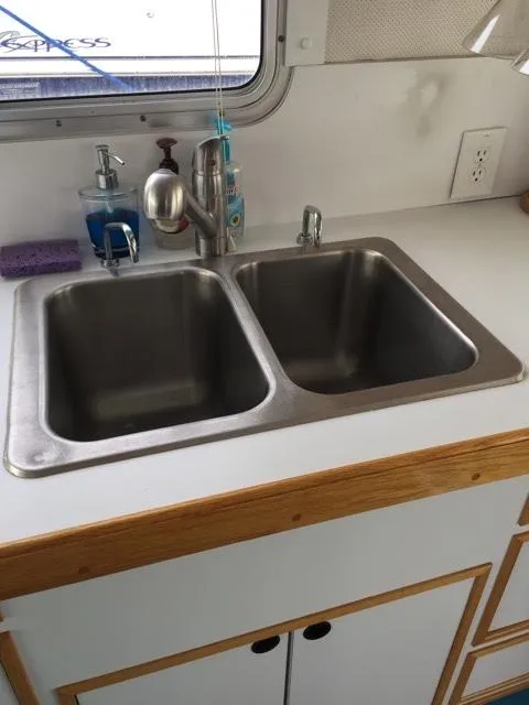 Slide: The Image of Double sink in a 2000 Provincial 42 Pleasure Boat kitchen. - 34