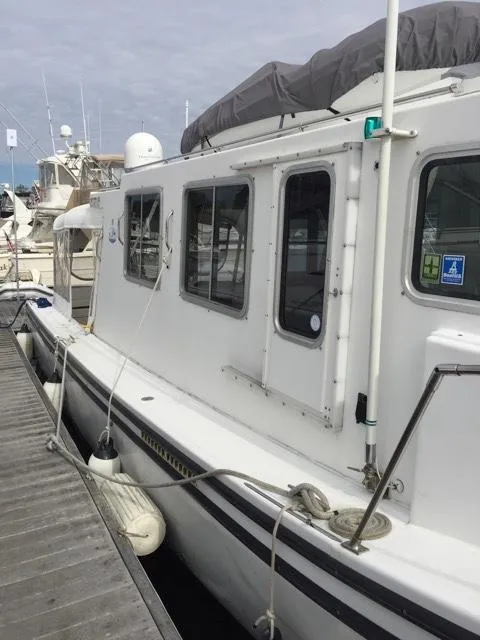 Slide: The Image of 2000 Provincial 42 Pleasure Boat docked at marina. - 5