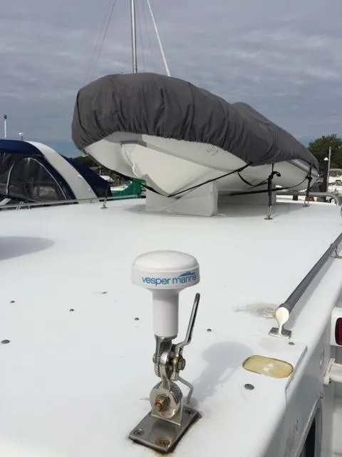 Slide: The Image of Provincial 42 Pleasure Boat with covered dinghy on deck, year 2000. - 8