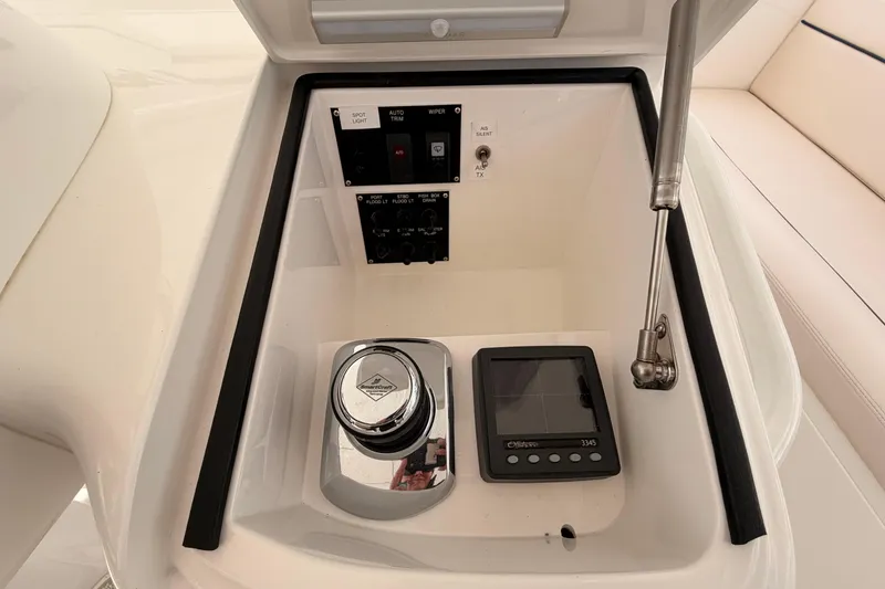 Slide: The Image of Control panel of a 2015 Viking 42 Open yacht with electronic displays and switches. - 17