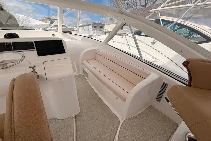 Slide: The Image of Interior of 2015 Viking 42 Open yacht with helm, seating, and navigation displays. - 19