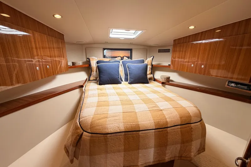 Slide: The Image of Luxurious cabin interior of 2015 Viking 42 Open yacht with cozy bedding. - 24