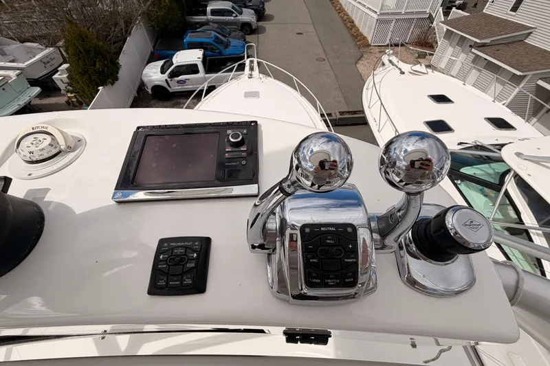 Slide: The Image of Control panel of a 2015 Viking 42 Open yacht with navigation instruments. - 8