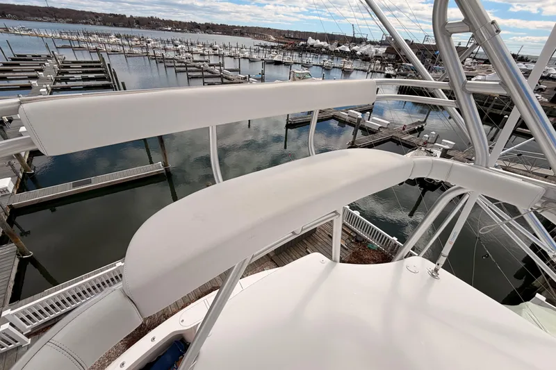 Slide: The Image of View from the 2015 Viking 42 Open yacht overlooking a marina with docks and boats. - 9