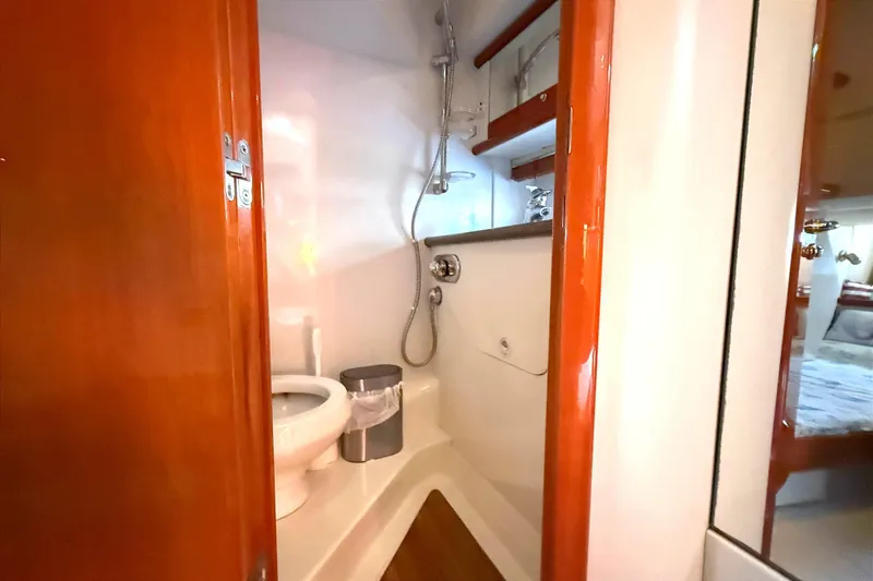 Slide: The Image of Bathroom interior of 2002 Sunseeker Camargue 44 yacht, featuring shower and toilet. - 17