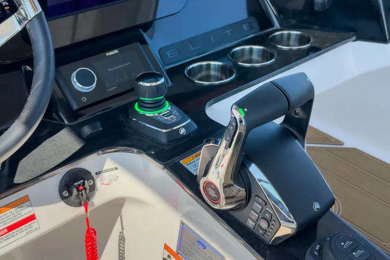 Slide: The Image of Control panel of 2026 Monterey Elite 30 OB boat with joystick and throttle. - 11
