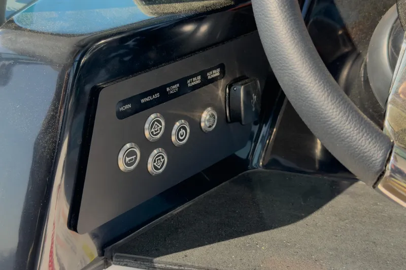 Slide: The Image of Control panel of 2026 Monterey Elite 30 OB boat with steering wheel. - 12