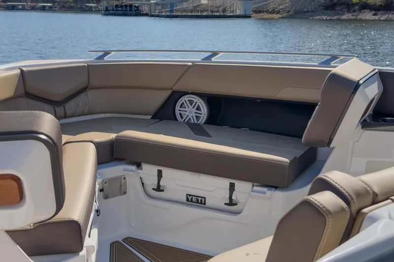 Slide: The Image of Luxurious seating on 2026 Monterey Elite 30 OB boat with lake view. - 15