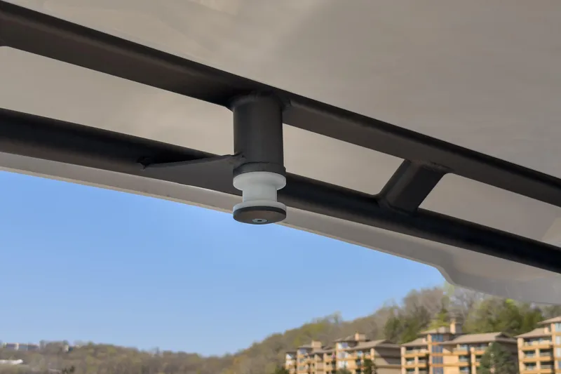 Slide: The Image of Close-up of a 2026 Monterey Elite 30 OB boat canopy detail against a clear sky. - 22