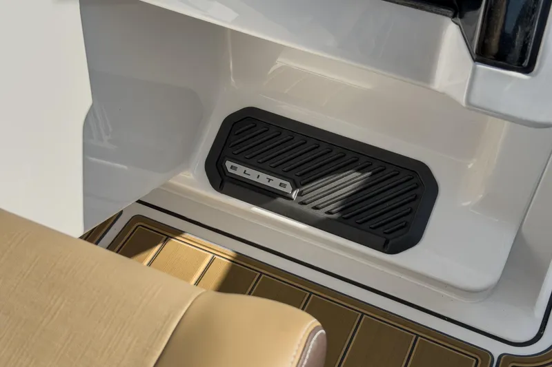 Slide: The Image of 2026 Monterey Elite 30 OB boat interior with branded step and tan seating. - 24