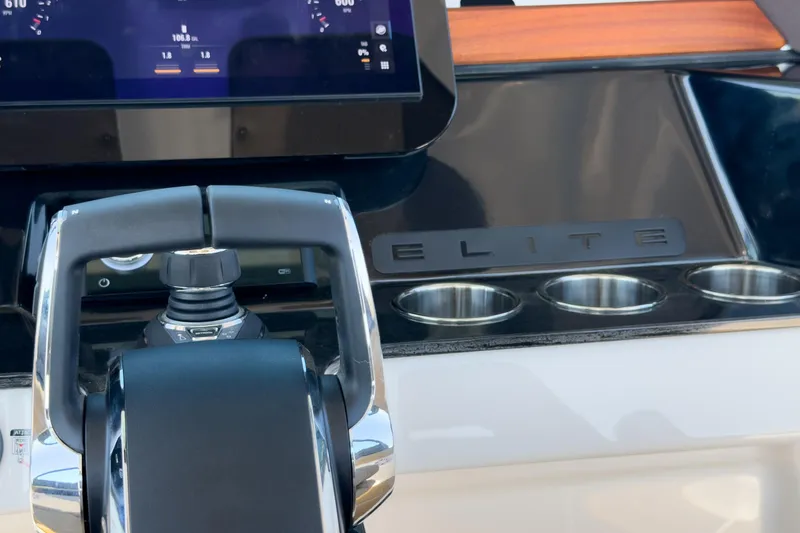 Slide: The Image of Control panel of 2026 Monterey Elite 30 OB boat with cup holders and digital display. - 31