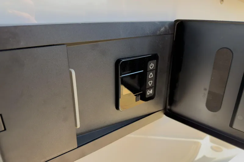 Slide: The Image of Control panel on 2026 Monterey Elite 30 OB boat, featuring modern interface. - 33