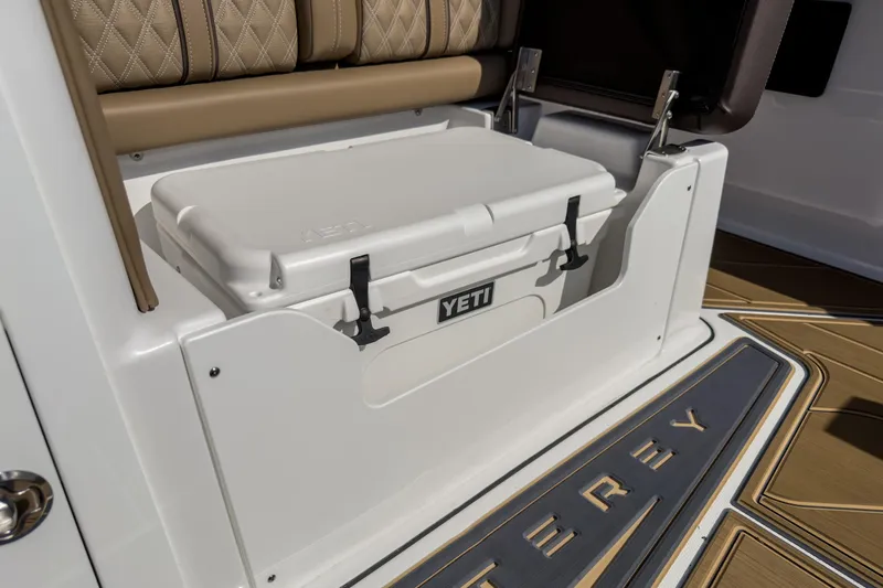 Slide: The Image of 2026 Monterey Elite 30 OB boat interior with Yeti cooler and luxury seating. - 34