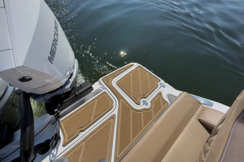 Slide: The Image of 2026 Monterey Elite 30 OB boat with Mercury engine, featuring teak deck and water view. - 37