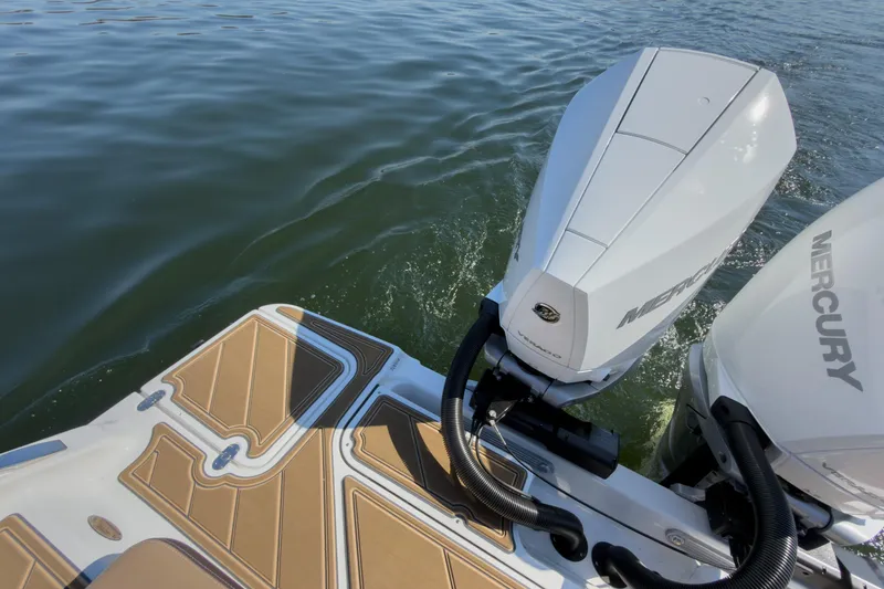 Slide: The Image of 2026 Monterey Elite 30 OB boat with Mercury outboard engines on water. - 38
