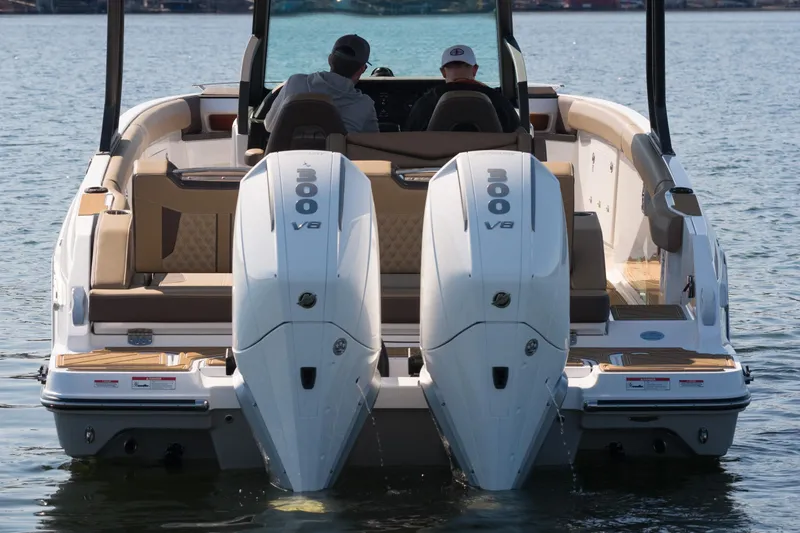 Slide: The Image of 2026 Monterey Elite 30 OB boat with dual 300 V8 engines on water. - 7
