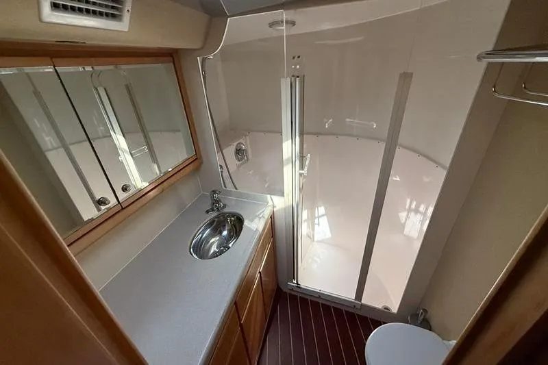 Slide: The Image of Bathroom interior of 1996 Bertram 50 Convertible yacht with shower and sink. - 24