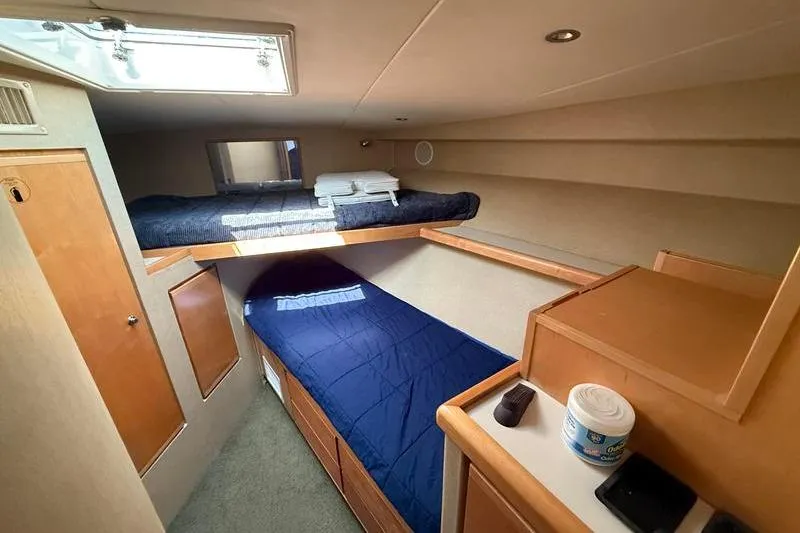 Slide: The Image of Interior cabin of a 1996 Bertram 50 Convertible yacht with bunk beds. - 26