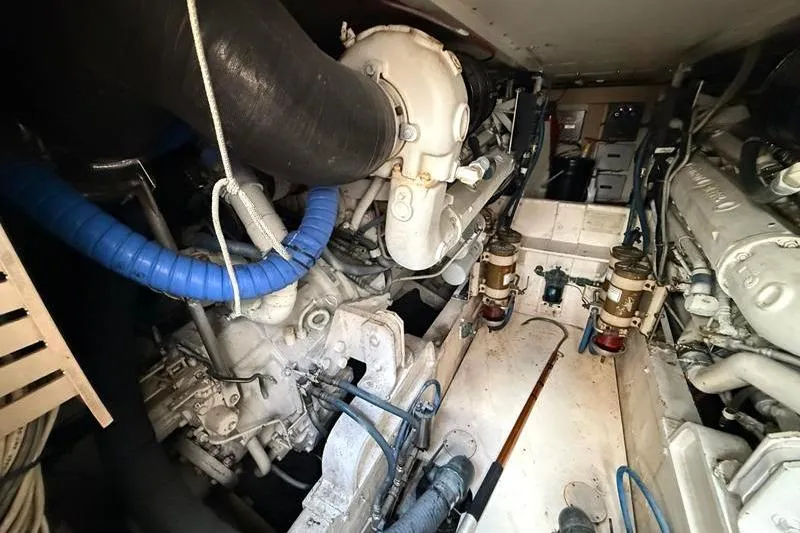 Slide: The Image of Engine room of a 1996 Bertram 50 Convertible yacht, showcasing mechanical components. - 40