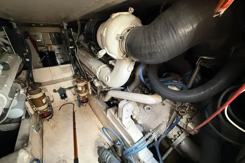 Slide: The Image of Engine room of a 1996 Bertram 50 Convertible boat, showcasing mechanical components. - 41
