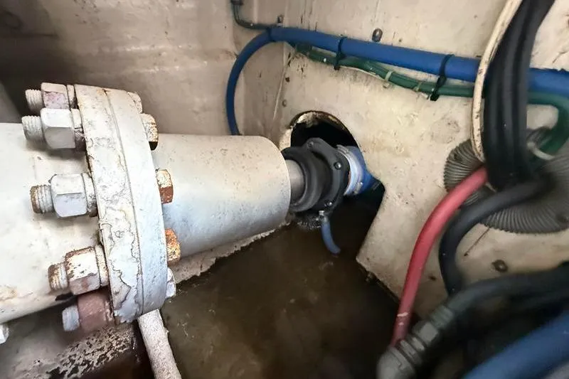 Slide: The Image of Engine room of a 1996 Bertram 50 Convertible boat, showing mechanical components and wiring. - 42