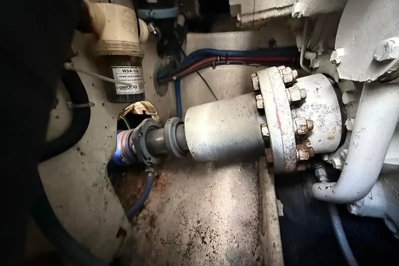 Slide: The Image of Engine room of a 1996 Bertram 50 Convertible boat, showing mechanical components and wiring. - 43