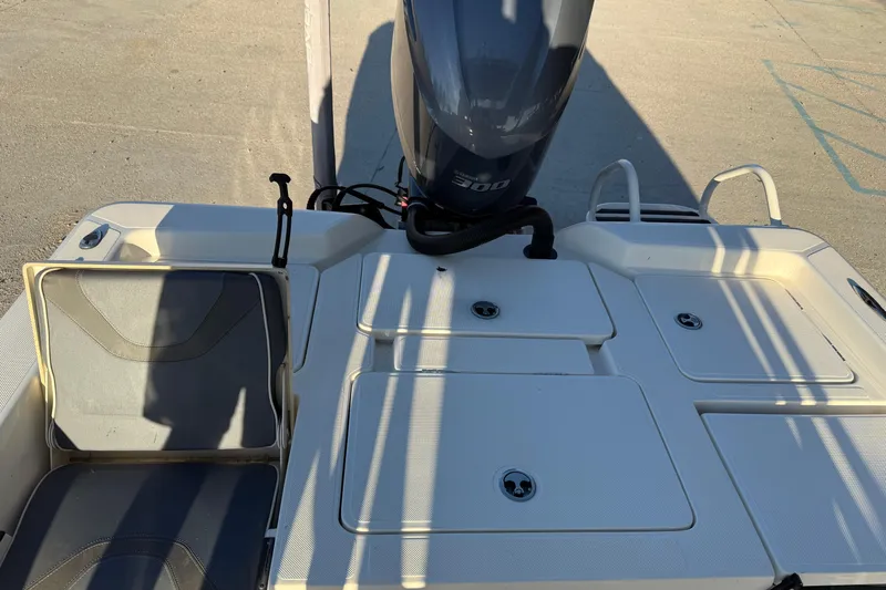 Slide: The Image of 2019 Skeeter SX240 boat deck with Yamaha 300 engine, featuring storage compartments and seating. - 14