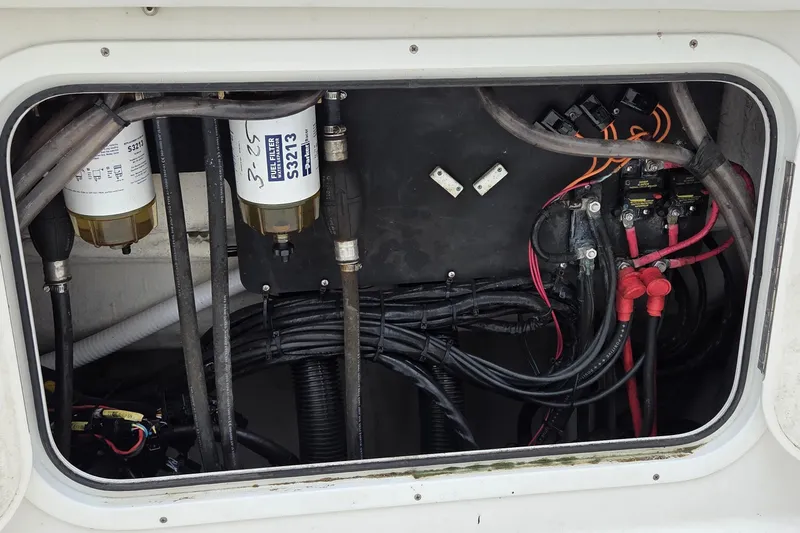 Slide: The Image of Electrical and fuel system components inside a 2016 Sailfish 320 CC boat. - 10
