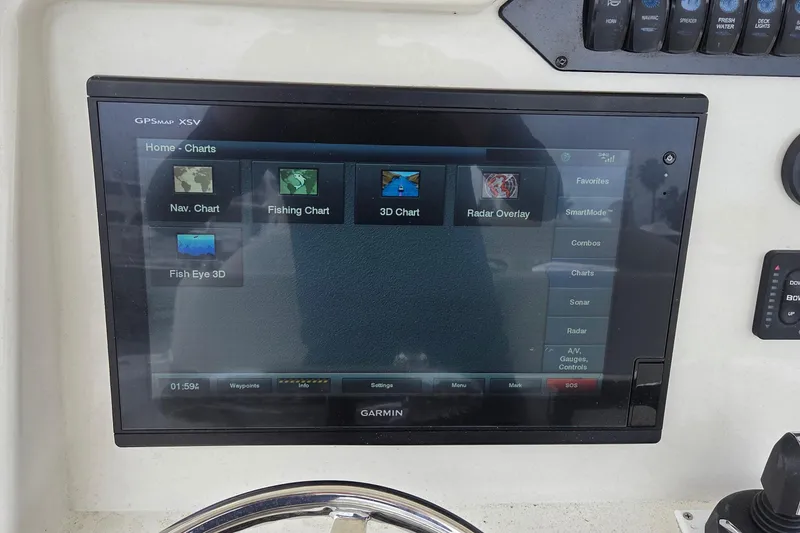 Slide: The Image of Garmin GPSMAP XSV display on 2016 Sailfish 320 CC boat, showing navigation and fishing charts. - 7