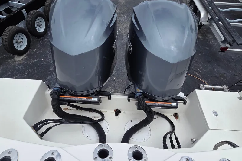 Slide: The Image of Twin Yamaha outboard engines on a 2016 Sailfish 320 CC boat, viewed from above. - 8
