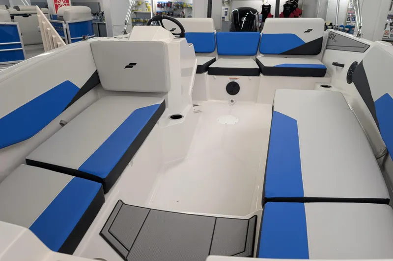Slide: The Image of 2025 Starcraft SV 16 OB boat interior with blue and gray seating, modern design. - 12