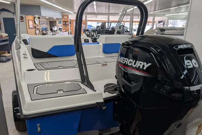 Slide: The Image of 2025 Starcraft SV 16 OB boat with Mercury 90 engine in showroom. - 8