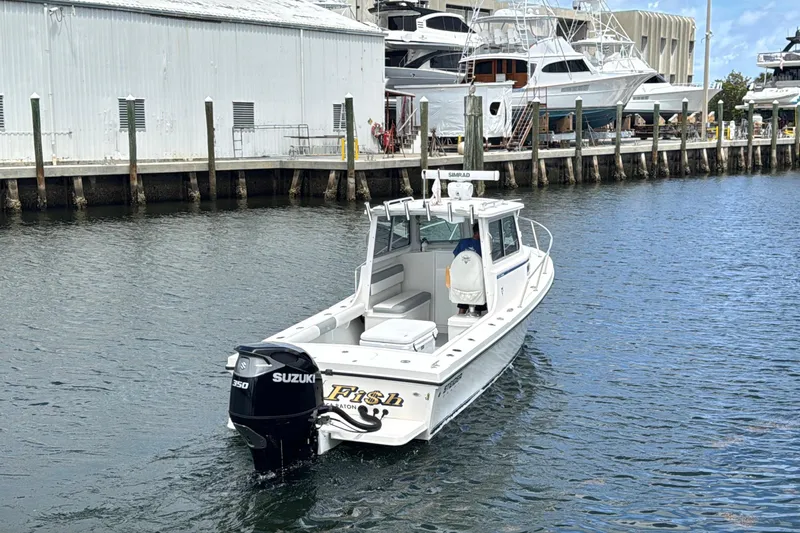 Slide: The Image of 2019 Steiger Craft 255 Miami boat with Suzuki engine docked at marina. - 1