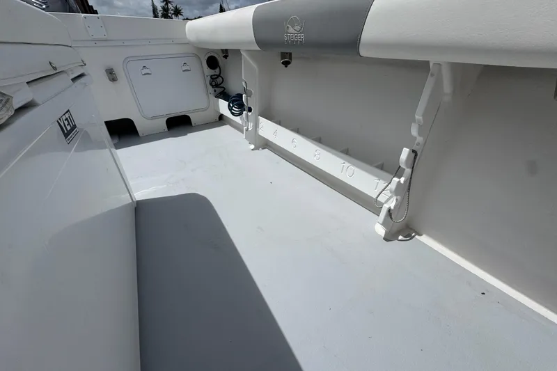 Slide: The Image of 2019 Steiger Craft 255 Miami boat interior with Yeti cooler and measuring scale. - 10